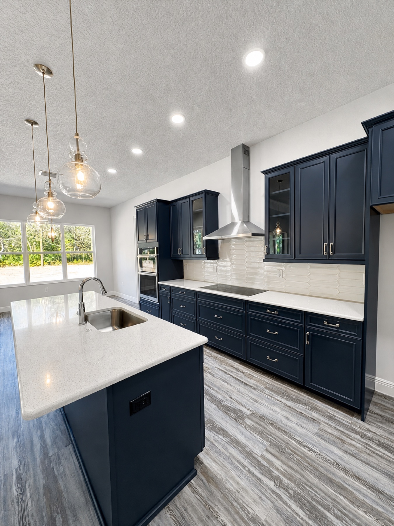 Clean modern kitchen with navy cabinetry
